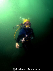 Surface supplied diver working on the bottom. by Andrew Mckaskle 